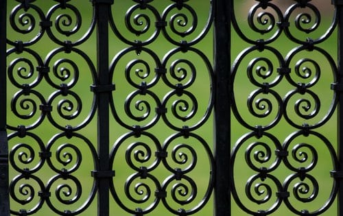 Ornate iron scrollwork railing detail